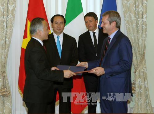 越南国家主席陈大光会见意大利总理马泰奥•伦齐 ảnh 2 越南国家主席陈大光会见意大利总理马泰奥•伦齐 ảnh 2