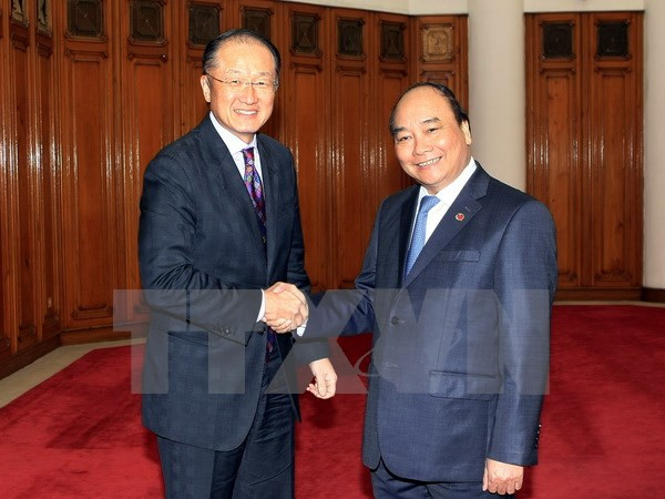 越南政府副总理阮春福会见世界银行行长金庸 ảnh 1 越南政府副总理阮春福会见世界银行行长金庸 ảnh 1