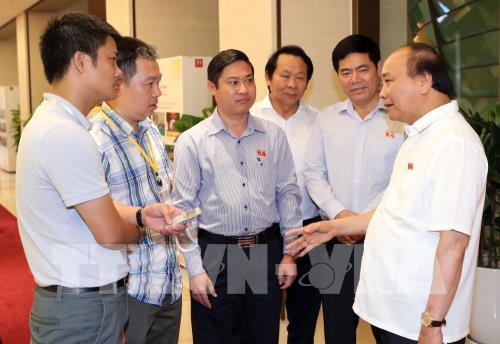 第十四届国会第五次会议：政府总理愿意倾听针对《特别行政经济单位法案》的意见 ảnh 1