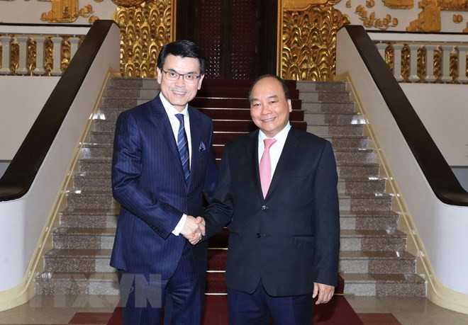 阮春福会见中国香港政府商务及经济发展局局长邱腾华 ảnh 1