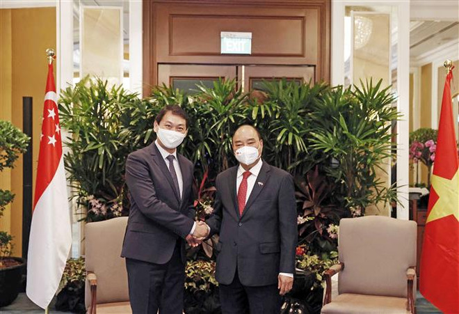 越南国家主席阮春福会见新加坡金融、能源企业领导 ảnh 4 越南国家主席阮春福会见新加坡金融、能源企业领导 ảnh 4