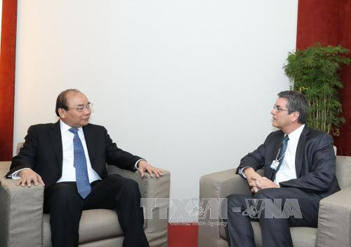 越南政府总理阮春福会见若干国际金融组织和企业领导 ảnh 2