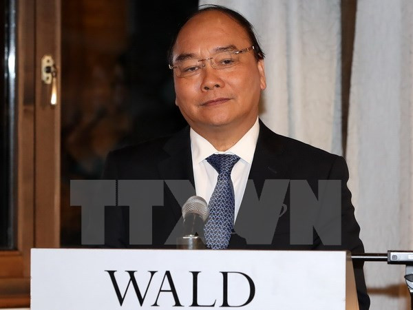 越南政府总理阮春福在达沃斯会见国际媒体记者 ảnh 1 越南政府总理阮春福在达沃斯会见国际媒体记者 ảnh 1
