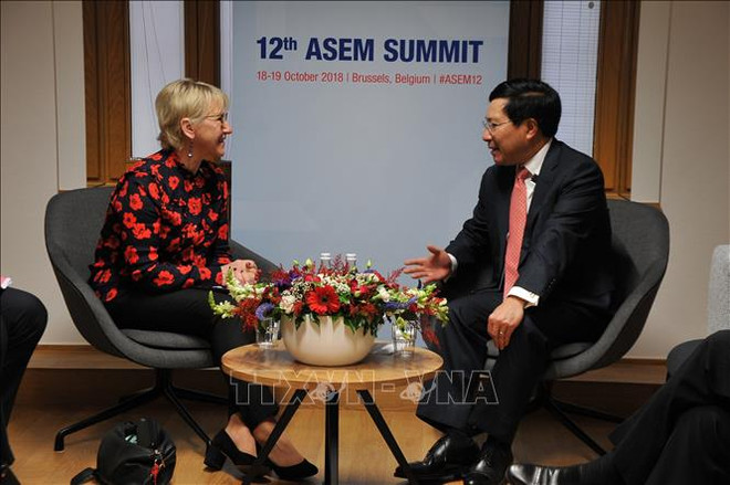 ASEM 12:越南政府副总理兼外长范平明进行多场双边会晤 ảnh 1 ASEM 12:越南政府副总理兼外长范平明进行多场双边会晤 ảnh 1