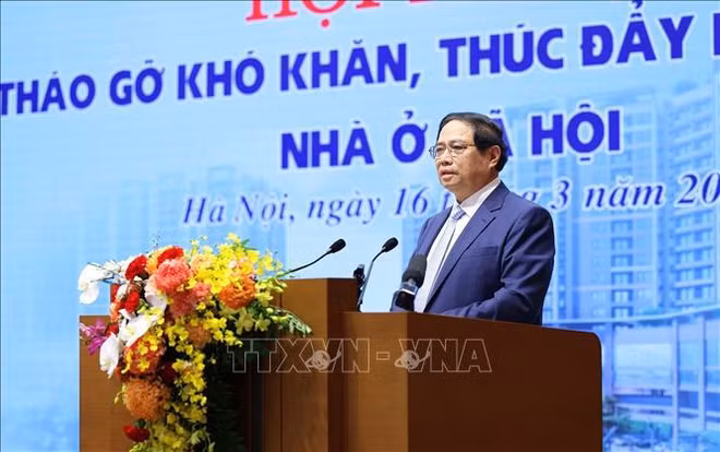 越南政府总理范明政主持召开消除困难 促进保障性住房发展会议 ảnh 1