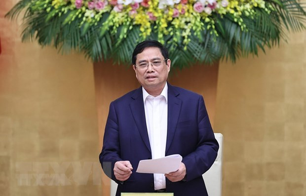 越南政府总理范明政同越南国家银行举行工作会议 ảnh 1