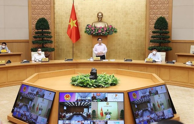 政府总理范明政：严厉打击在防疫药品和物资采购方面的腐败现象 ảnh 1