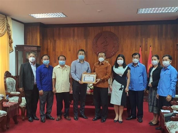 新冠肺炎疫情:在老越南人社群同老挝政府携手共同抗击疫情 ảnh 1 新冠肺炎疫情:在老越南人社群同老挝政府携手共同抗击疫情 ảnh 1