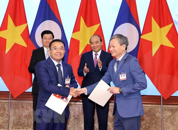 越南电力集团与老挝签署多项购电谅解备忘录 ảnh 1
