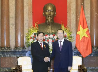 越南国家主席陈大光会见老挝最高人民法院院长坎潘·西提丹帕 ảnh 1