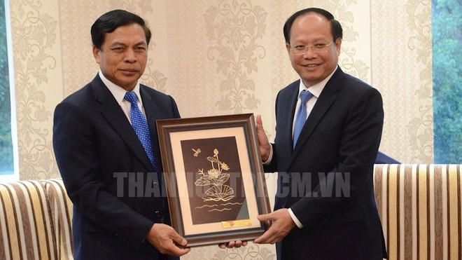 胡志明市领导会见老挝最高人民检察院检察长 ảnh 1