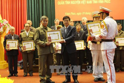 越南援老志愿军和专家荣获老挝国家的勋章 ảnh 1