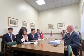 工作会议现场。图自越通社