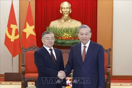 越共中央总书记苏林会见中共中央宣传部部长李书磊。图自越通社