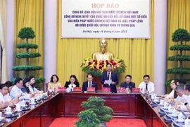 新闻发布会场景。图自越通社