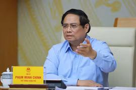 政府总理范明政在会议上发言。图自越通社