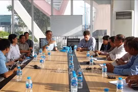 工作会议现场。图自越通社