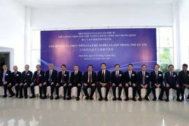 与会代表合影。图自越通社