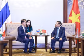 范明政总理会见开泰银行董事长钟拉·拉塔纳皮安。图自越通社