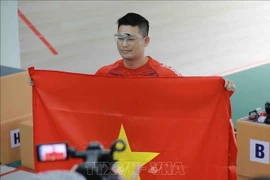 越南选手何明成破纪录夺金。图自越通社