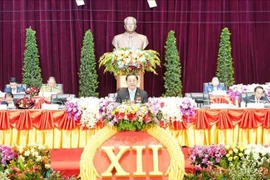 老挝人民革命党第十二次全国代表大会开幕式现场。图自越通社