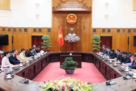 会见现场。图自越通社