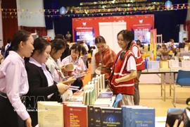 老挝第六届国际图书节现场。图自越通社