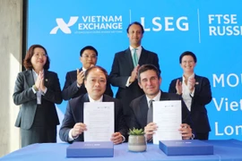 越南证券交易所（VNX）与富时国际有限公司（FTSE）签署合作备忘录。图自越通社