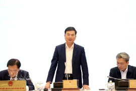 越南国家银行副行长范青河发言。图自越通社