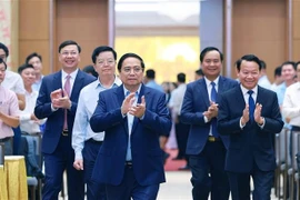 越南政府总理范明政主持新农村建设与扶贫工作全国视频会议。图自越通社