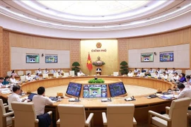 政府总理范明政主持召开政府9月份例行会议。图自越通社