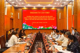 工作会谈现场。图自越通社