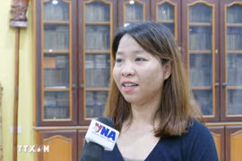 老挝万象越南人协会办公室主任阮氏秋玄。图自越通社