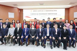 与会代表合影。图自越通社