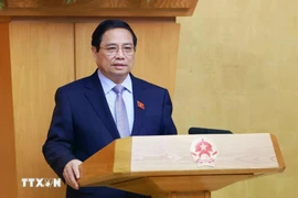 范明政总理发表讲话。图自越通社