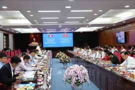 工作会议场景。图自越通社