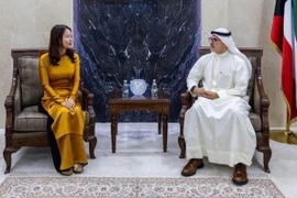 越南外交部副部长阮明姮与科威特外交部常务副部长谢赫·贾拉·贾比尔·阿勒艾哈迈德·阿勒萨巴赫。图自越通社