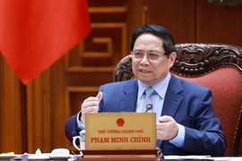 越南政府总理范明政在会议上发言。图自越通社