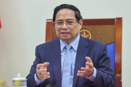 越南政府总理范明政与德国总理弗里德里希·默茨通电话。图自越通社