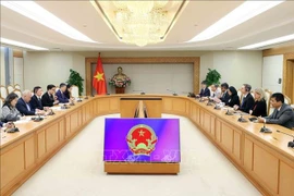 会见现场。图自越通社