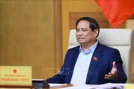 政府总理范明政在会议上发言。图自越通社