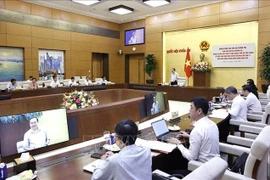 工作会议场景。图自越通社