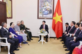 越南国家主席梁强会见中国友好人士家属代表。图自越通社