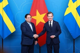 越南政府总理范明政与瑞典首相乌尔夫·克里斯特松。图自越通社