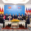 越南外交部党委与柬埔寨人民党中央对外委员会签署合作协议。 图自越通社