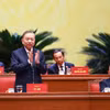 大会主席团主席、总书记苏林同志代表主席团主持会议 图自越通社
