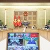 越南政府总理范明政1月7日主持召开视频会议，部署加快推进中部地区“光中战役”，要求以“神速”精神完成因台风、洪水受损民房的重建与修缮。图自越通社
