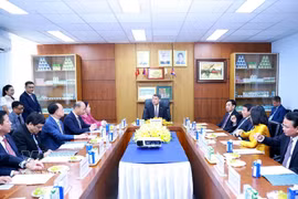 黎明兴总理与Vinamilk股份公司领导举行工作会谈。图自越通社