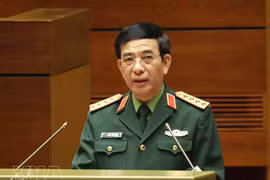 中央政治局委员、中央军委副书记、国防部长潘文江大将在会议上作报告。图自越通社