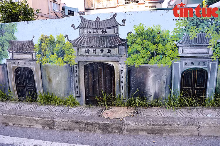 通过这些壁画，人们可看到龙边桥、嘉林火车站、丽密村等首都河内龙边郡熟悉的地方。图自越通社《信息报》